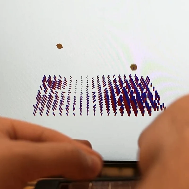 نمایش ردیابی مهره‌های مغناطیسی روی نمایشگر؛ Courtesy of the researchers / MIT News