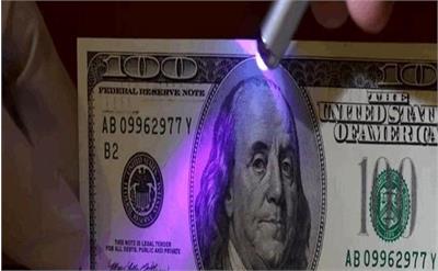 انهدام باند فروش دلارهای تقلبی در میدان آزادی تهران