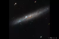 Hubble Reveals NGC 1827: How to Read a Galaxy Seen Edge-On
